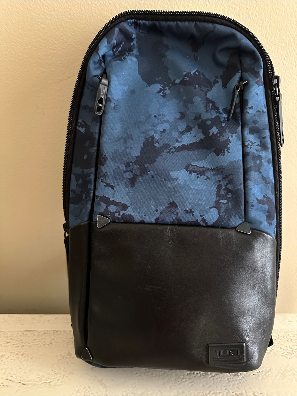 Tumi Black Leather & Blue Camouflage Sling Backpack